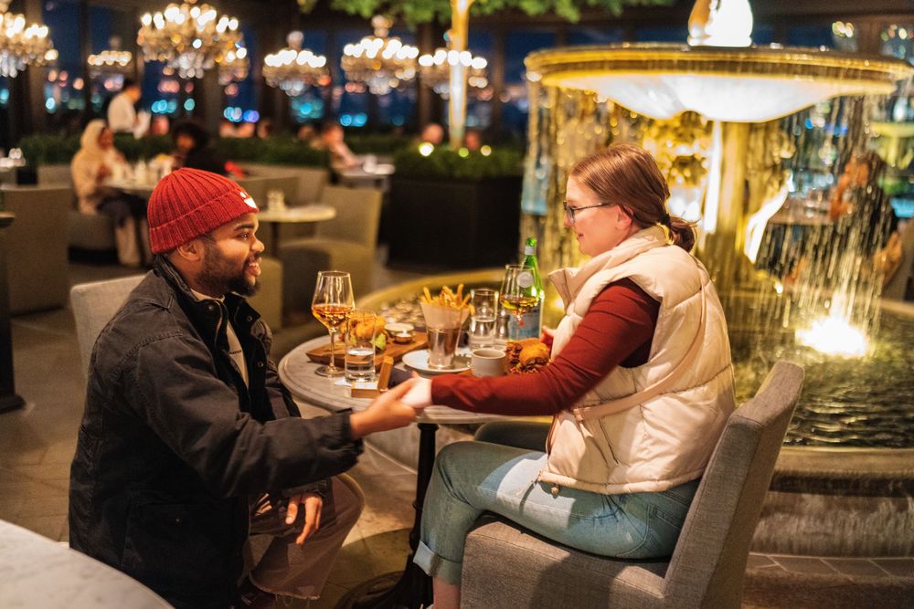 Proposal at a candlelit restaurant table
