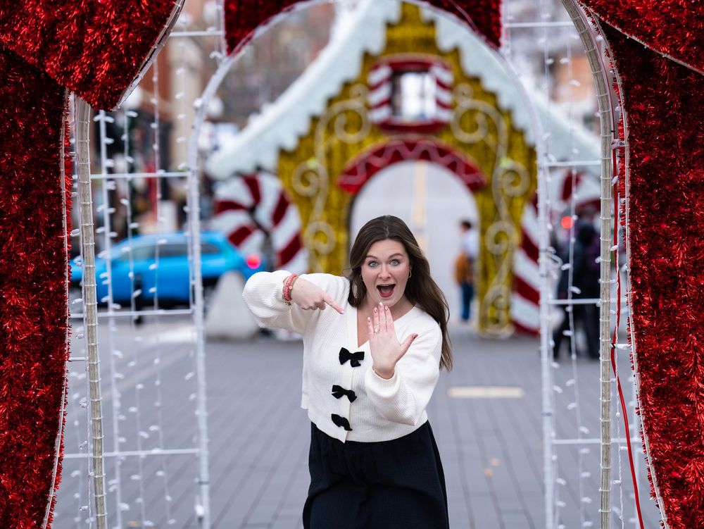 Surprised reaction under holiday lights