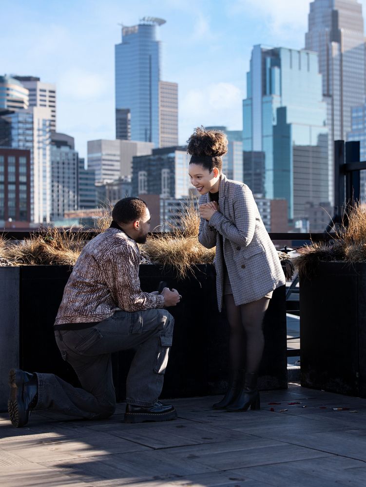 Rooftop proposal with the Minneapolis skyline
